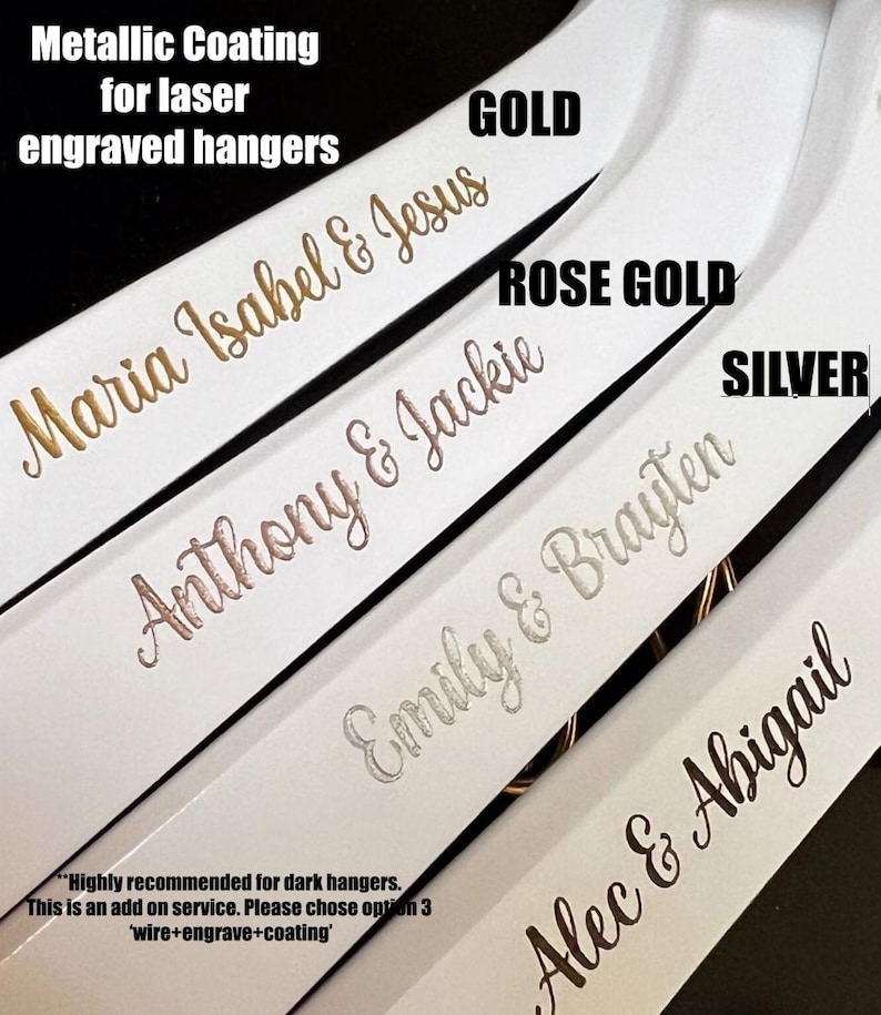May include: Five white wooden hangers with laser engraved names in gold, rose gold, and silver metallic finishes. The text on the hangers reads "Maria Isabel & Jesus", "Anthony & Jackie", "Emily & Brayten", and "Alec & Abigail".