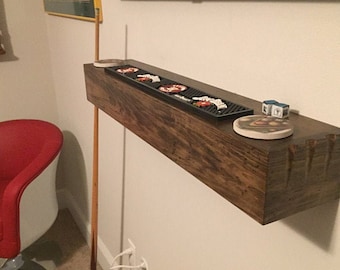 Floating shelf for pool cues