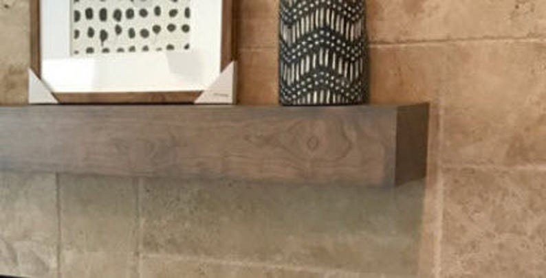 Light grey cherry wood beam mantel.