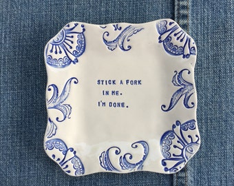 stamped clay 'stick a fork in me' floral ceramic plate