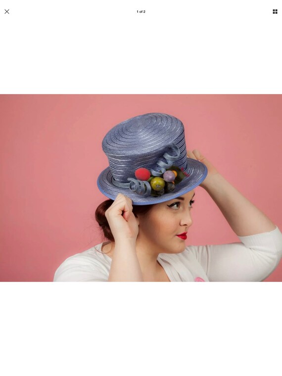 Blue formal hat with fruity twist
