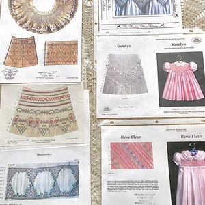 May include: A collection of embroidery patterns for smocking, featuring designs for collars, bonnets, and dresses. The patterns are printed on white paper with black text and illustrations. The patterns are titled "Molly's Collar and Bonnet", "Manderley", "Katelyn", and "Rose Fleur".