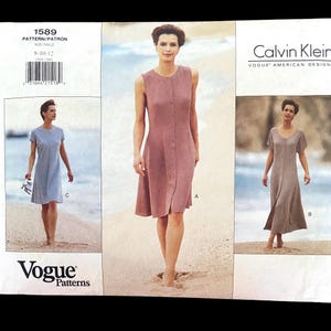 May include: Vogue Patterns sewing pattern 1589 featuring three dress designs. The pattern includes a sleeveless button-down dress, a short-sleeved dress, and a dress with a v-neck. The Calvin Klein logo is visible.