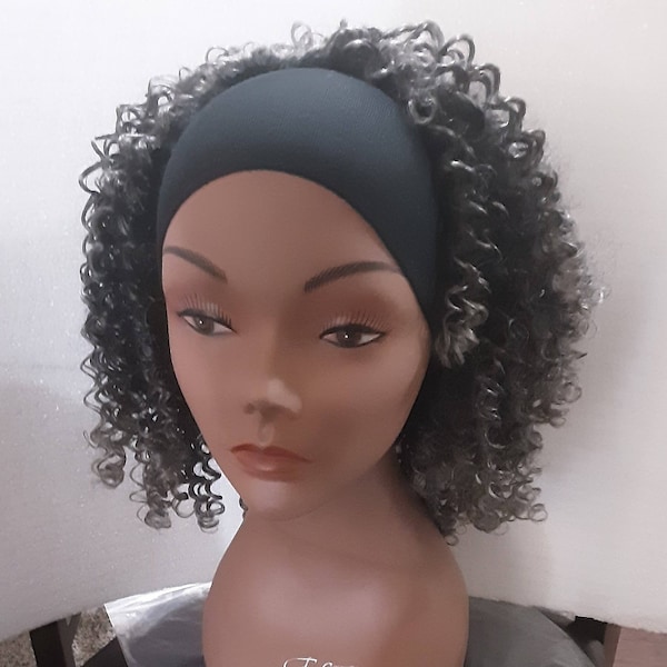 Shirley is a ten inch gray and black half wig with curls that are hard to find.  Longlasting curls and ombre color. synthetic material