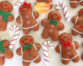 May include: A collection of brown felt gingerbread people ornaments featuring white rickrack trim, red and green felt bows, and peppermint candy accents, interspersed with white and red striped felt candy canes. Includes a PDF PATTERN label.