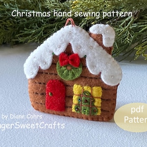 May include: A felt gingerbread house Christmas ornament sewing pattern. The pattern includes a red door, a green wreath, and a yellow window. The pattern is available as a PDF download. "Christmas hand sewing pattern" and "GingerSweetCrafts" are written on the image.