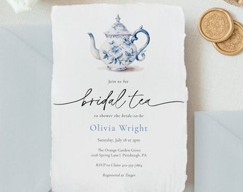 May include: A blue and white teapot with floral designs is featured on a white invitation for a bridal tea shower. The invitation includes the text "Join us for bridal tea to shower the bride-to-be Olivia Wright Saturday, July 18 at 2pm The Orange Garden Grove 1028 Spring Lane | Pittsburgh, PA RSVP to Claire 412-355-7864 Registered at Target"