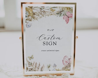 Op de afbeelding: Een gouden lijst met een witte achtergrond en een bloemige rand. Het bord zegt "Custom SIGN create unlimited signs" en heeft de afmetingen 8" x 10".