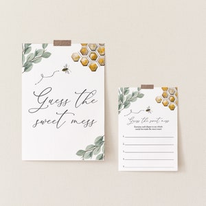 May include: A printable baby shower game card with a bee and honeycomb design. The card says "Guess the sweet mess" and has instructions to examine each diaper to see which candy bar made the sweet mess.