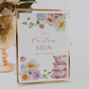 May include: A printable 8x10 inch sign with a floral design and a stack of pink teacups. The sign says "Custom Sign" and "create unlimited signs".