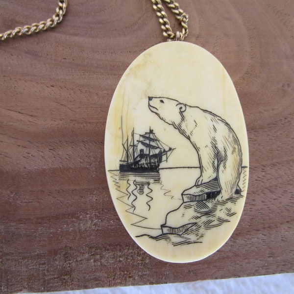 POLAR BEAR  LOOKING at a Sailing ship , he is standing on a block of ice , he is on a cabochon of scrimshaw