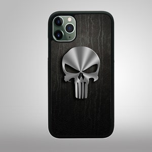 May include: A black phone case with a textured wood-like design and a silver skull graphic. The skull has a raised, 3D effect.