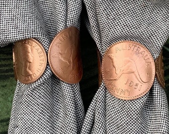 Two copper penny napkin rings