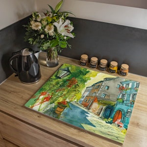 Plaque de recouvrement de poêle en verre de banjado 60 x 52 cm avec motif CENTRE VILLE HISTORIQUE