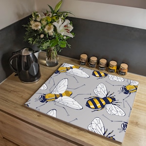 Plaque de couverture de poêle en verre de banjado 60 x 52 cm avec un motif de MOUCHES ET D'ABEILLES