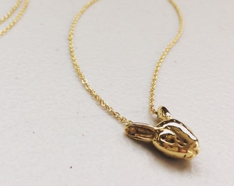 Handmade solid recycled gold plated sterling silver bunny necklace set on a delicate chain.