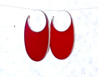 Handmade sterling silver and red resin hoop earrings.