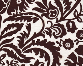 May include: A brown and white floral pattern fabric with a paisley design.