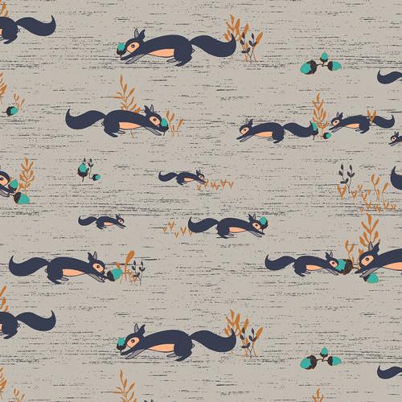 May include: A seamless pattern featuring a repeating design of squirrels carrying acorns on a light gray background with a subtle textured effect. The squirrels are depicted in a cartoon style with dark blue bodies and orange accents.