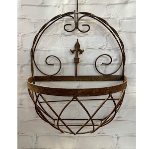 May include: A rustic wooden sign with the text "Welcome to our home" in white lettering. The sign features a distressed finish and a simple, inviting design, perfect for a front porch or entryway.