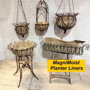 May include: Assortment of decorative metal planters in various styles. Includes hanging baskets, a tall stand planter, and a long trough planter. All planters have a brown metal finish and beige liners. The image also includes the text "MagniMoist Planter Liners".