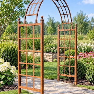 May include: A tall, arched garden trellis made of brown metal with a grid pattern. The structure features two vertical side panels with square openings and a curved top section, topped with small decorative spheres on each of the four posts.
