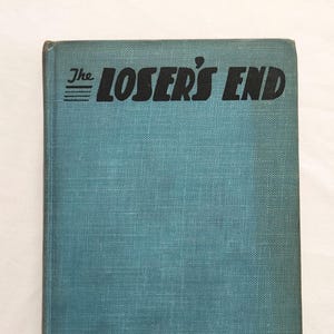 May include: A vintage book titled "The Loser's End" by William Heyliger. The book has a teal cover with black text. The cover has a textured appearance. The title is in a bold, sans-serif font.