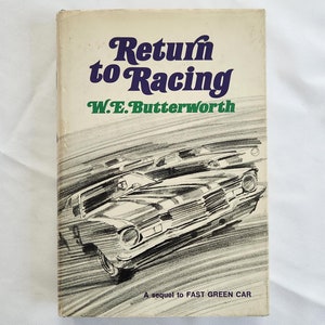May include: A book titled "Return to Racing" by W.E. Butterworth. The cover features a black and white illustration of a car speeding on a race track. The text "A sequel to FAST GREEN CAR" is printed at the bottom of the cover.