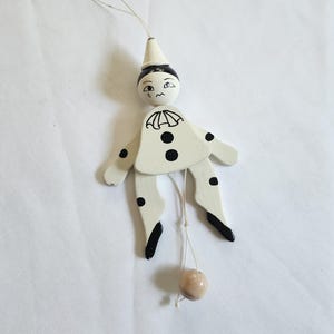 May include: A set of three ceramic mugs with a speckled, matte finish. The mugs are in shades of cream, light gray, and dark gray. Each mug has a simple, minimalist design, perfect for coffee or tea.