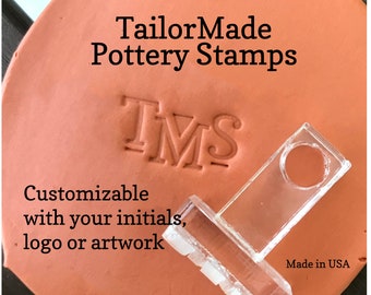 May include: A clear plastic pottery stamp with the letters "TMS" imprinted on a terracotta surface. The text "TailorMade Pottery Stamps" and "Customizable with your initials, logo or artwork" is also visible. The stamp is made in the USA.