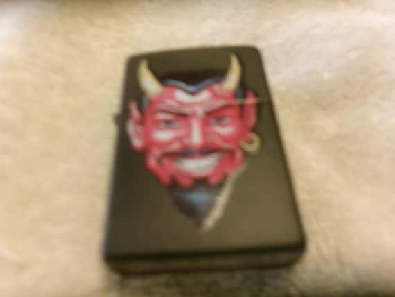 the devil's cigarette lighter Vintage Zippo Devil Head Black Cigarette Lighter