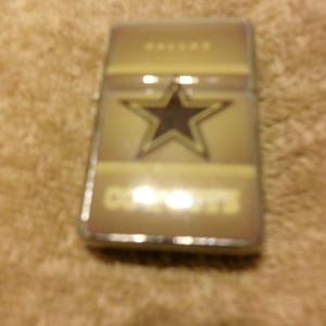dallas cowboys cigarette lighter BIC NFL Multipurpose Maxi Pocket Lighters Set, Child-Resistant, 6-Pack with the NFL Dallas Cowboys wordmark on the lid and the team logo appearing in the negative space of the color image design Zippo Dallas Cowboys