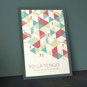 May include: A poster with a geometric pattern of red, blue, and yellow triangles. The poster features the text "Yo La Tengo" and "End of the Road Festival 2024" with the location "Lamer Tree Gardens, Baldock, UK".