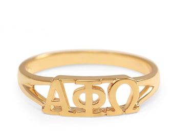 May include: A gold-colored ring with the letters "ΑΦΩ" engraved on it.