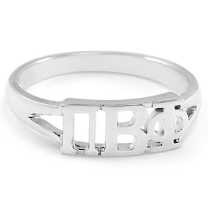 May include: A silver ring with the letters "ΠΒΦ" cut out of the band.