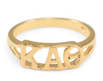 May include: A gold ring with the letters "KAO" in a cutout design.