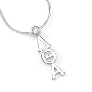 May include: Silver necklace with a pendant featuring the Greek letters Delta, Omega, and Alpha, with a clear crystal stone at the top.