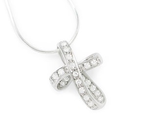May include: A silver necklace with a diamond-encrusted pendant shaped like a bow.
