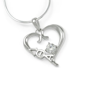 May include: Silver heart-shaped pendant necklace with a clear crystal stone and the Greek letters "AOA" inside the heart.