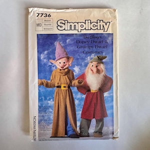 May include: A vintage Simplicity sewing pattern for Walt Disney's Dopey Dwarf and Grumpy Dwarf costumes. The pattern cover displays illustrations of the characters. The pattern is labelled "7736" and "Medium".