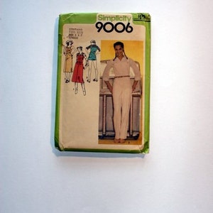 May include: A Simplicity sewing pattern envelope with the number 9006 printed on the front. The envelope shows a woman wearing a white jumpsuit with a belt. The pattern contains two sizes, sizes 8 and 12.
