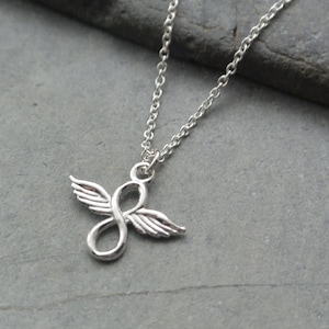 May include: A silver necklace with an infinity symbol pendant featuring angel wings.