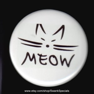 Meow.  Pinback button or magnet