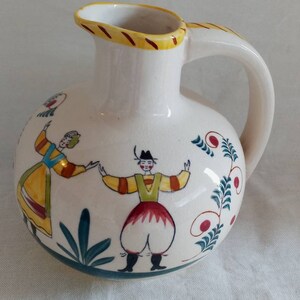 Folk art vintage man and women on jug pitcher