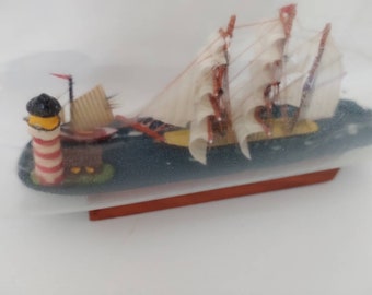 Vintage ship in a  long bottle