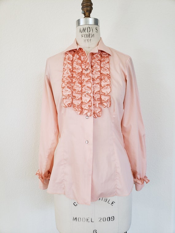 pink blouse with ruffles