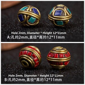 May include: Two round beads, one with blue and green accents and one with red accents. Both beads are approximately 12 mm in diameter and 11 mm in height. The beads have a hole in the center that is approximately 2 mm in diameter.  "Hole 2mm, Diameter * Height 12*11mm A:孔约2mm,直径*高约12*11mm Hole 2mm, Diameter * Height 12*11mm B:孔约2mm,直径*高约12*11mm"