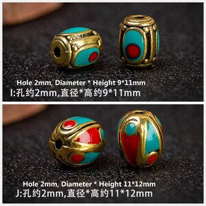 May include: Two oval-shaped beads with a gold finish and turquoise and red enamel. The beads have a hole in the center for stringing. The text "Hole 2mm, Diameter * Height 9*11mm" and "I:孔约2mm,直径*高约9*11mm" is below the beads. The text "Hole 2mm, Diameter * Height 11*12mm" and "J:孔约2mm,直径*高约11*12mm" is below the beads.