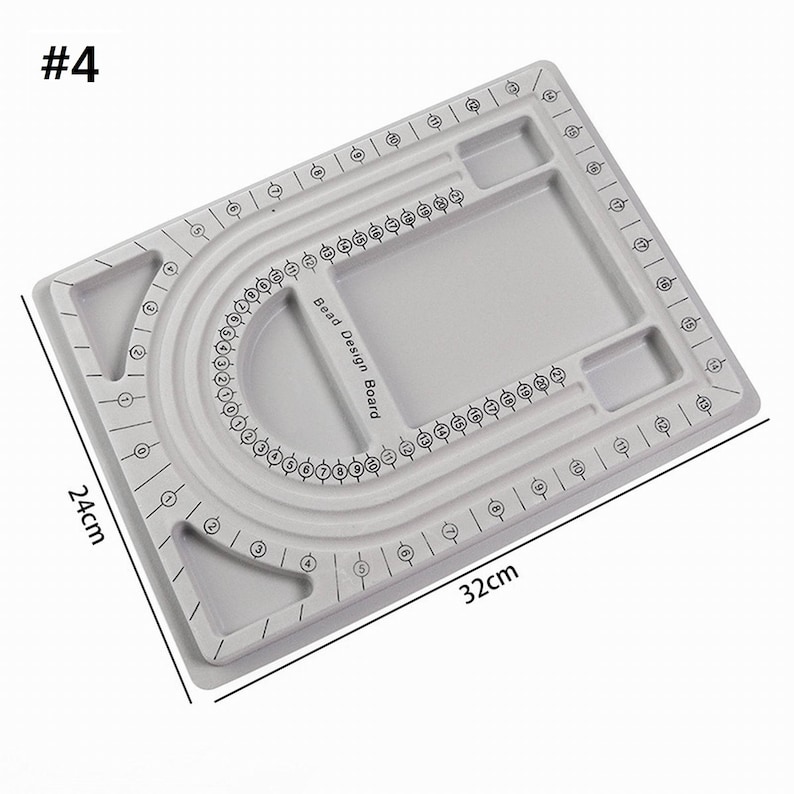 May include: Gray bead design board with a U-shaped groove for stringing beads. The board has a grid pattern with numbers for bead placement. It also has two small compartments for storing beads. The board measures 12.6 inches by 9.8 inches.