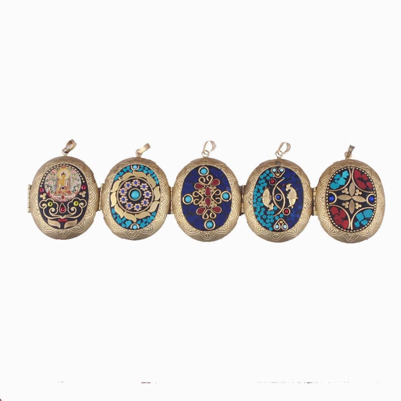 May include: Five oval-shaped brass locket pendants with intricate designs. Each locket features a different colorful mosaic pattern with turquoise, blue, red, and gold accents.